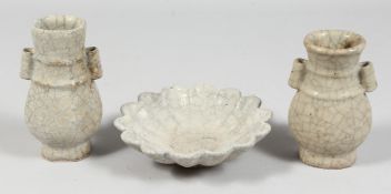 A GROUP OF THREE CRACKLE GLAZE POTTERY PIECES comprising two small arrow vases and a small ribbed