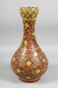 A GOOD LARGE CHINESE IRON-RED PORCELAIN GARLIC HEAD VASE, painted all over with flowerhead and