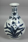 A CHINESE BLUE AND WHITE PORCELAIN YUHUCHUNPIN VASE, decorated with native flora, with six-character