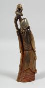 A CHINESE CARVED BOVINE HORN FIGURE of Shou Lao, 25cm high.