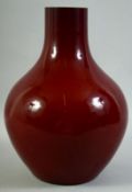 A LARGE CHINESE SANG DE BOEUF GLAZE VASE, 32.5cm high.