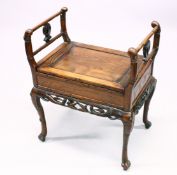 A CHINESE HARDWOOD WINDOW SEAT, with hinged seat and incised decoration, legs carved as bamboo. 71cm