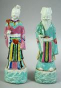 A PAIR OF 18TH CENTURY CHINESE PORCELAIN IMMORTAL FIGURES, both approx. 23cm high.