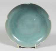 A CHINESE CELADON PETAL-FORMED PORCELAIN DISH. 15.cm diameter
