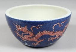 A LARGE CHINESE SPECKLED-BLUE GROUND PORCELAIN BOWL, decorated with dragons and the flaming pearl of