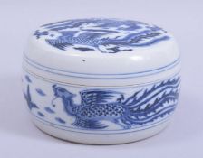 A CHINESE BLUE AND WHITE CYLINDRICAL PORCELAIN PHOENIX BOX AND COVER, decorated with phoenix and