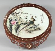 AN EARLY 20TH CENTURY CHINESE FAMILLE ROSE PORCELAIN PANEL, encased in a bone-inlaid hardwood frame,
