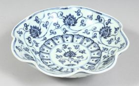 A CHINESE BLUE AND WHITE PETAL-FORMED PORCELAIN DISH, the interior decorated with lotus and