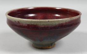 A CHINESE FLAMBE GLAZE POTTERY BOWL. 18cm diameter