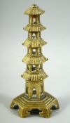 A BRASS MODEL OF A PAGODA, 19.5cm high.
