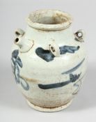 A CHINESE MING DYNASTY BLUE AND WHITE GLAZED POTTERY EWER with four ring handles to the shoulder.
