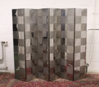 Mod-British School, Circa 1960, a steel six-fold screen, decorated with an alternating pattern of