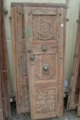 A good pair of Indian carved hardwood doors with bronze mounts.