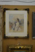 A watercolour study of two young children, signed, in a decorative gilt frame.