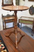 A mahogany tripod table.