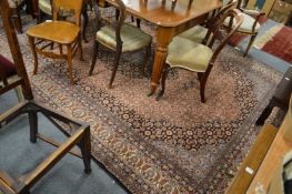 A machine made Persian style carpet 345cms x 250cms.