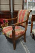 A French Empire mahogany framed armchair.