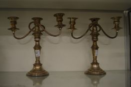 A pair of plated three light candelabra.