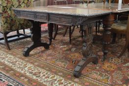 A 19th century Anglo Indian carved rosewood pedestal side table with two frieze drawers on carved