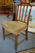 A set of four mahogany dining chairs.