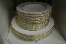 A quantity of Royal Worcester Gold Chantilly soup bowls and plates.