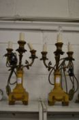 A pair of alabaster and ormolu three branch candelabra.