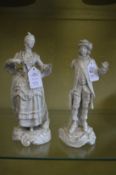 A pair of Dresden white porcelain figures (AF).