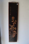 A pair of Japanese lacquer panels with incised decoration.
