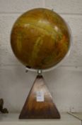 A table globe on stand.