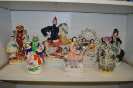 A group of Staffordshire figures.