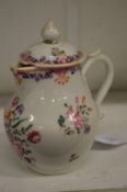 A 19th century Famille Rose porcelain jug and cover.