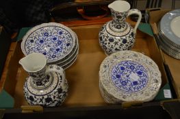 A pair of Iznik style porcelain ewers and similar plates and dishes.
