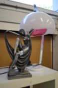 An Art Nouveau style lamp and a stylish table lamp.
