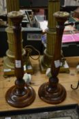 A pair of turned wood candlesticks with ormolu mounts.