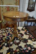 A 19th century mahogany circular drum table, on tripod base.