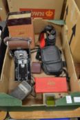 A Polaroid land camera model 95 and other camera equipment.