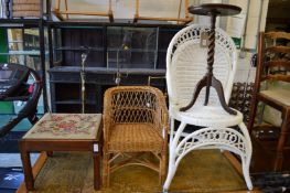 Two wicker chairs, a wine table and a stool.