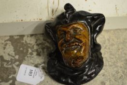 A small pottery wall mask 