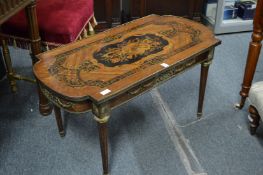 A French style, decoratively inlaid and painted coffee table.