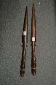 Two African carved wood spears.