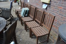 Six garden dining chairs with cushions.