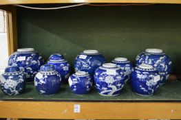 A large quantity of Chinese prunus pattern ginger jars, some with covers.