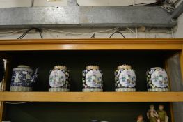 Chinese jars and covers and a teapot.