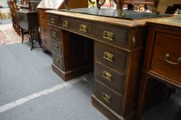 An oak pedestal desk.