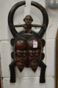 An African carved wood wall mask.