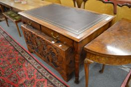 A mahogany two drawer writing table.