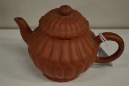 A Chinese chrysanthemum shaped Yixing teapot.