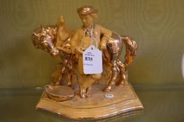 A lustre ware figure group.