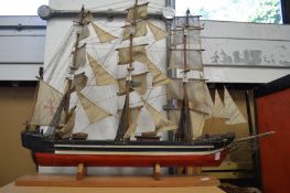 A good painted wood model of a three masted sailing ship.