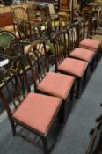 A good set of five Georgian style mahogany dining chairs with carved and pierced backs, drop-in